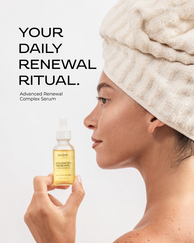 Woman with a towel around her hair holding SOLÉNA Advanced Renewal Complex Serum, with daily renewal ritual wording.